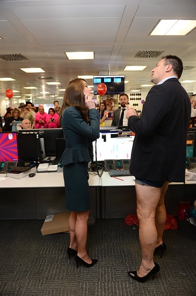 LONDON, ENGLAND - DECEMBER 09: Catherine, Duchess of Cambridge meets trader Nigel Hallagan as she and Prince William, Duke of Cambridge attend the ICAP charity day at ICAP on December 9, 2015 in London, England.  (Photo by Jeremy Selwyn - WPA Pool/Getty Images)